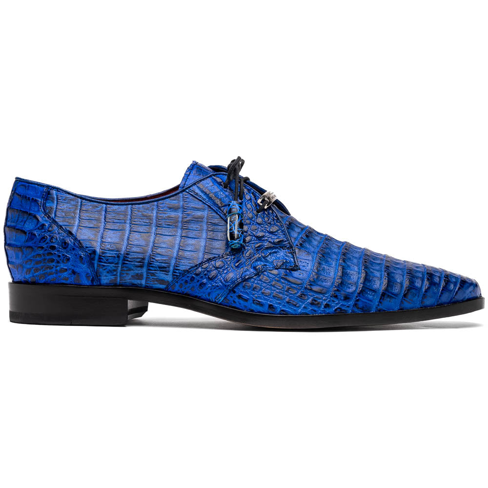 Marco Di Milano’s Lacio Electric Blue men’s dress shoes feature genuine caiman crocodile leather in blue, black laces, a bold red interior, with one shoe standing upright and the other lying on its side.