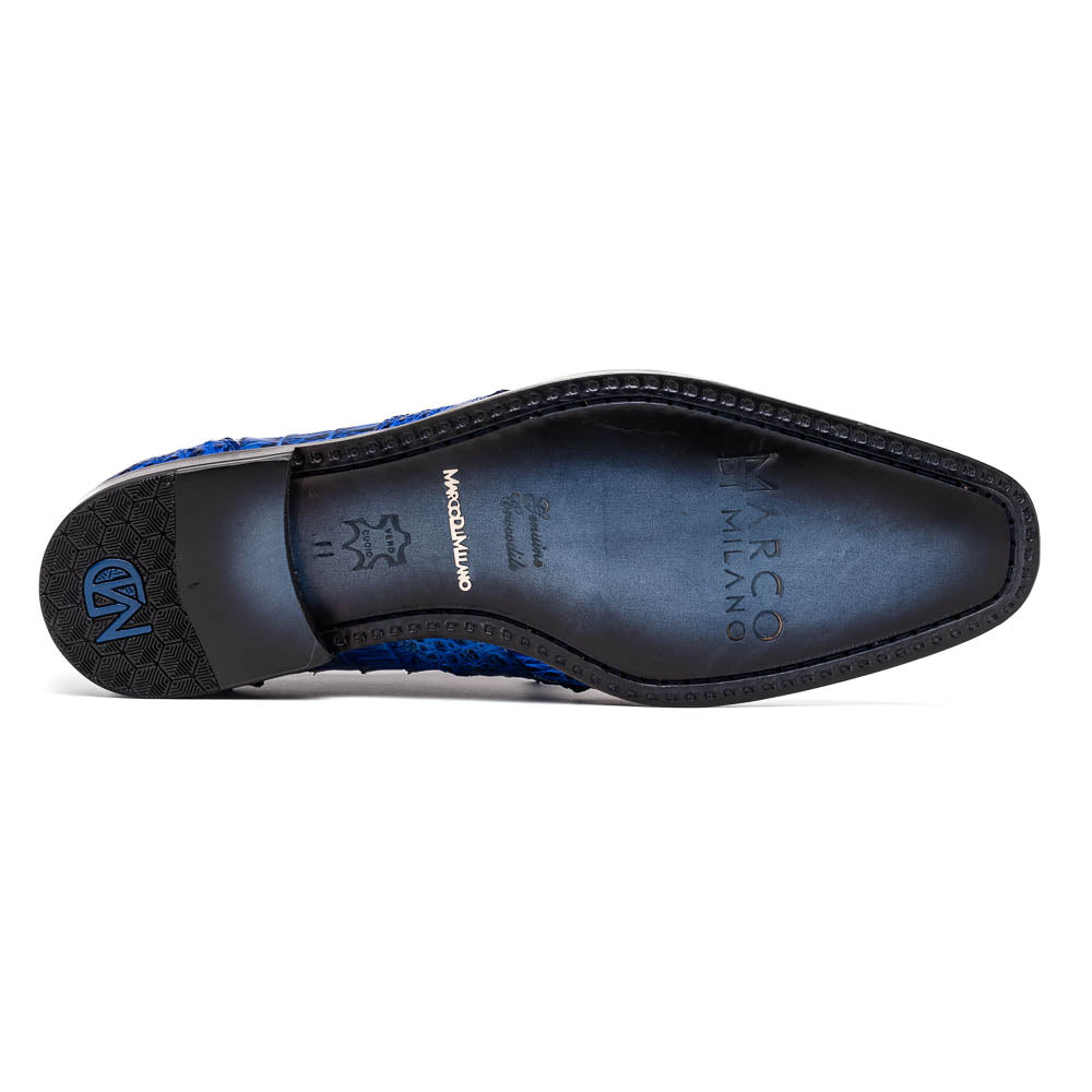 Marco Di Milano’s Lacio Electric Blue men’s dress shoes feature genuine caiman crocodile leather in blue, black laces, a bold red interior, with one shoe standing upright and the other lying on its side.