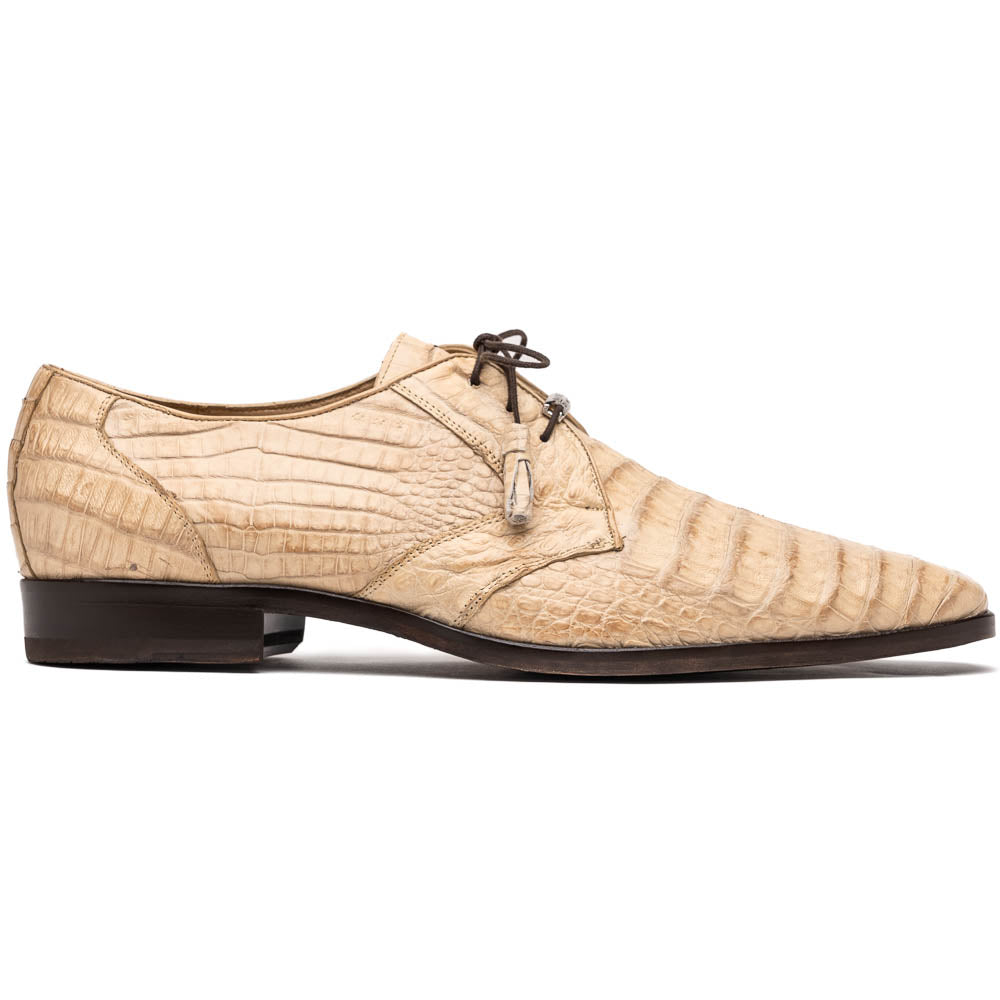 A pair of beige Marco Di Milano Lacio Orix shoes in genuine caiman crocodile, featuring a luxury derby design with dark brown laces—one upright, the other on its side to display the detailed sole.