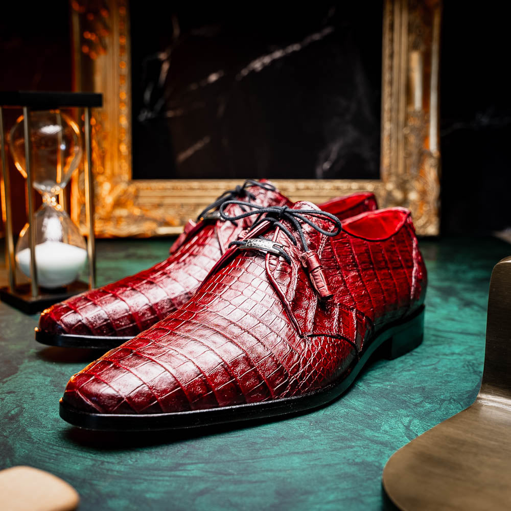 The Lacio Wine by Marco Di Milano is a luxury men's dress shoe crafted from brown genuine caiman crocodile leather, featuring a red inner lining, black laces, and "Marco Di Milano" branding on the tan leather sole.