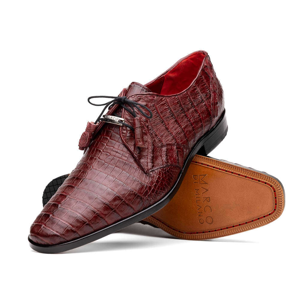 The Lacio Wine by Marco Di Milano is a luxury men's dress shoe crafted from brown genuine caiman crocodile leather, featuring a red inner lining, black laces, and "Marco Di Milano" branding on the tan leather sole.