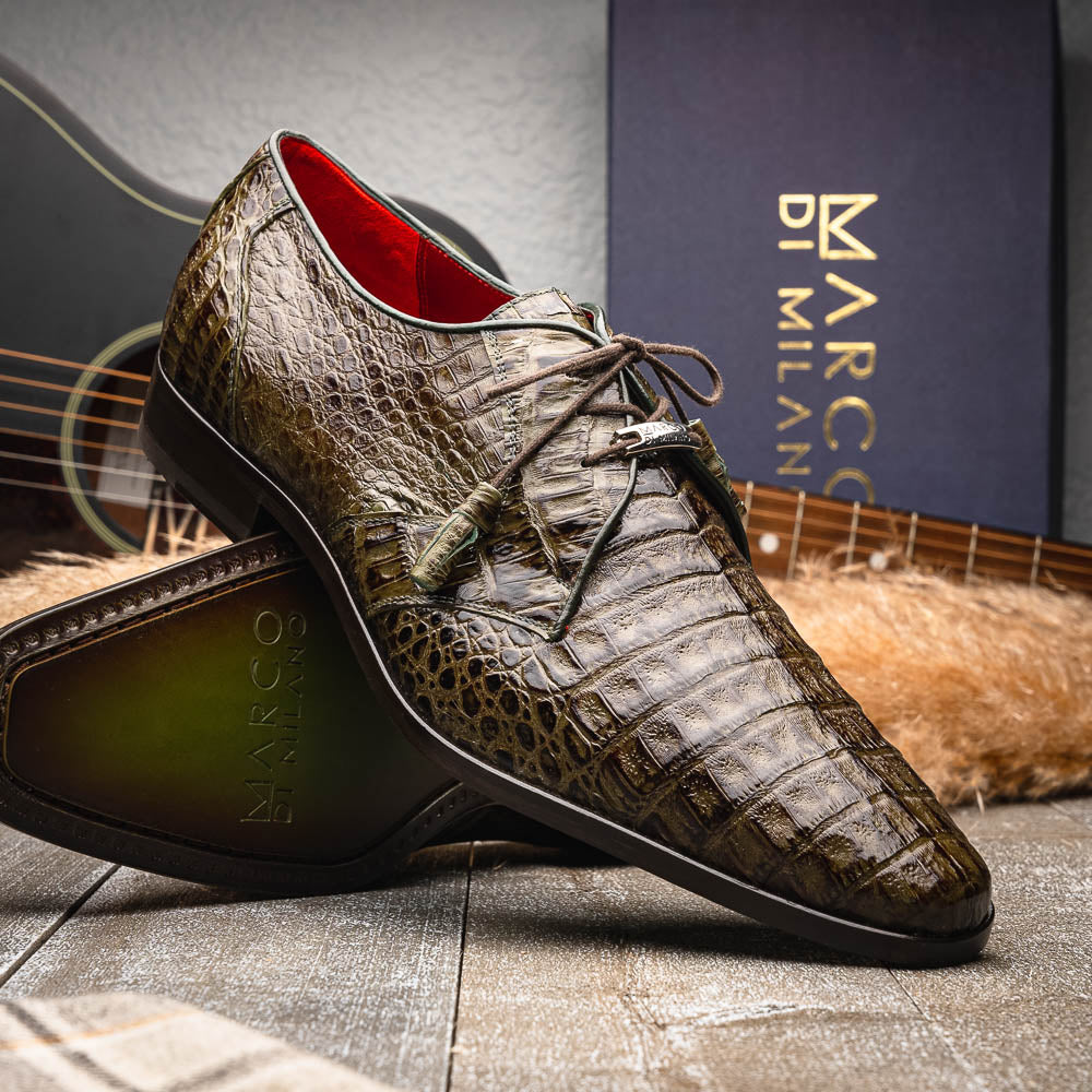 The Marco Di Milano Lacio WoodGreen men's dress shoes, made from genuine caiman crocodile leather with laces, red interior lining, and branded soles, are elegantly displayed against a white background.