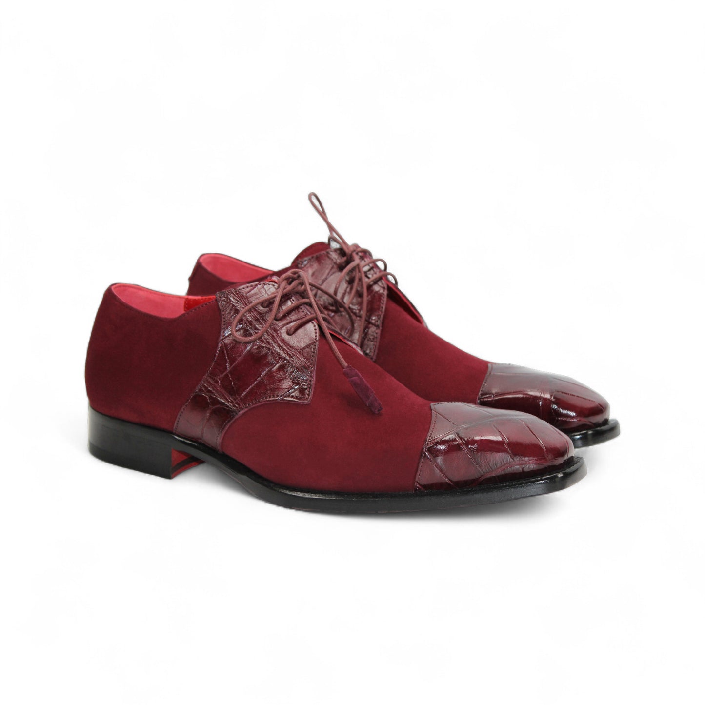 The Fennix Landon Burgundy by Fennix of Italy is a men's luxury oxford dress shoe in burgundy suede and leather with laces, Italian craftsmanship, and a low black heel, shown on a white background.