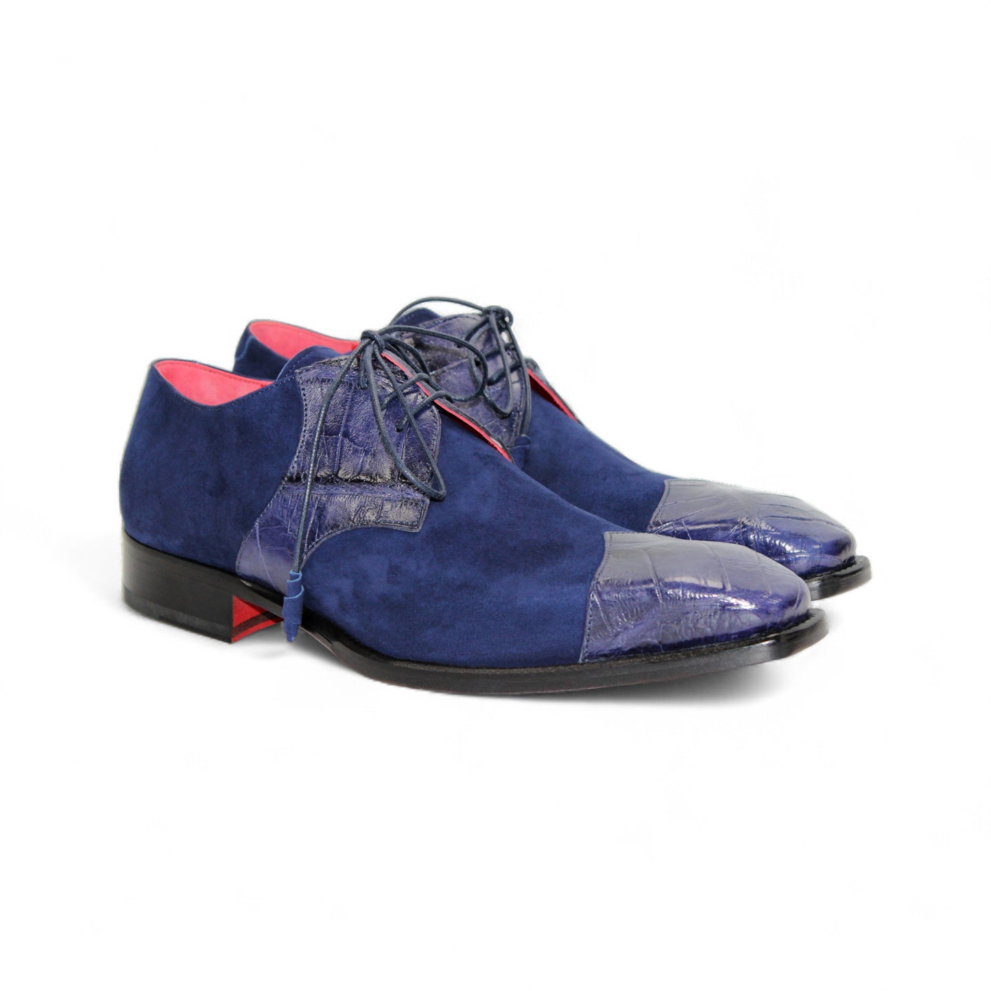 The Fennix Landon Navy by Fennix of Italy showcases Italian craftsmanship with luxurious blue suede and leather, a low heel, cap toe, and red lining—an elegant shoe displayed in profile on a white background.