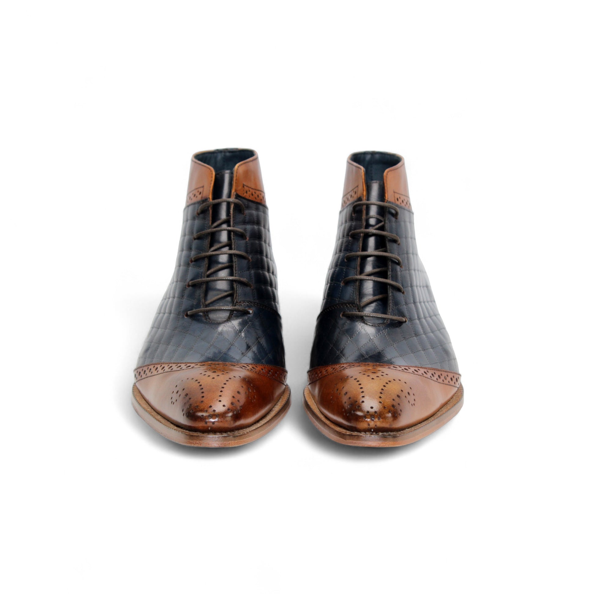 The Duca Lauro Cognac/Navy by Duca Di Matiste is a men's dress shoe featuring a black quilted leather body, brown leather trims, lace-up closure, and wooden sole—crafted in the refined tradition of Italian shoemaking.
