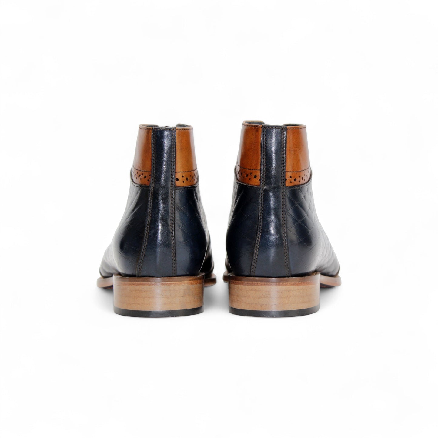 The Duca Lauro Cognac/Navy by Duca Di Matiste is a men's dress shoe featuring a black quilted leather body, brown leather trims, lace-up closure, and wooden sole—crafted in the refined tradition of Italian shoemaking.