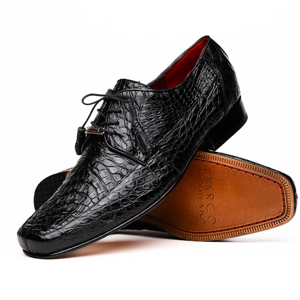 A pair of Marco Di Milano Leonardo Black luxury derby shoes in genuine caiman crocodile leather—one shoe upright, the other showing the tan sole with "Marco di Milano" text.