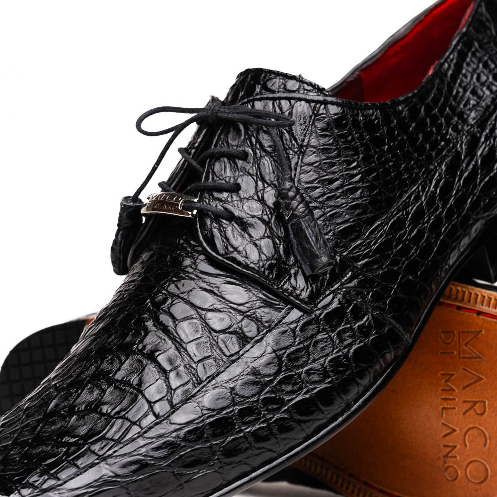 A pair of Marco Di Milano Leonardo Black luxury derby shoes in genuine caiman crocodile leather—one shoe upright, the other showing the tan sole with "Marco di Milano" text.