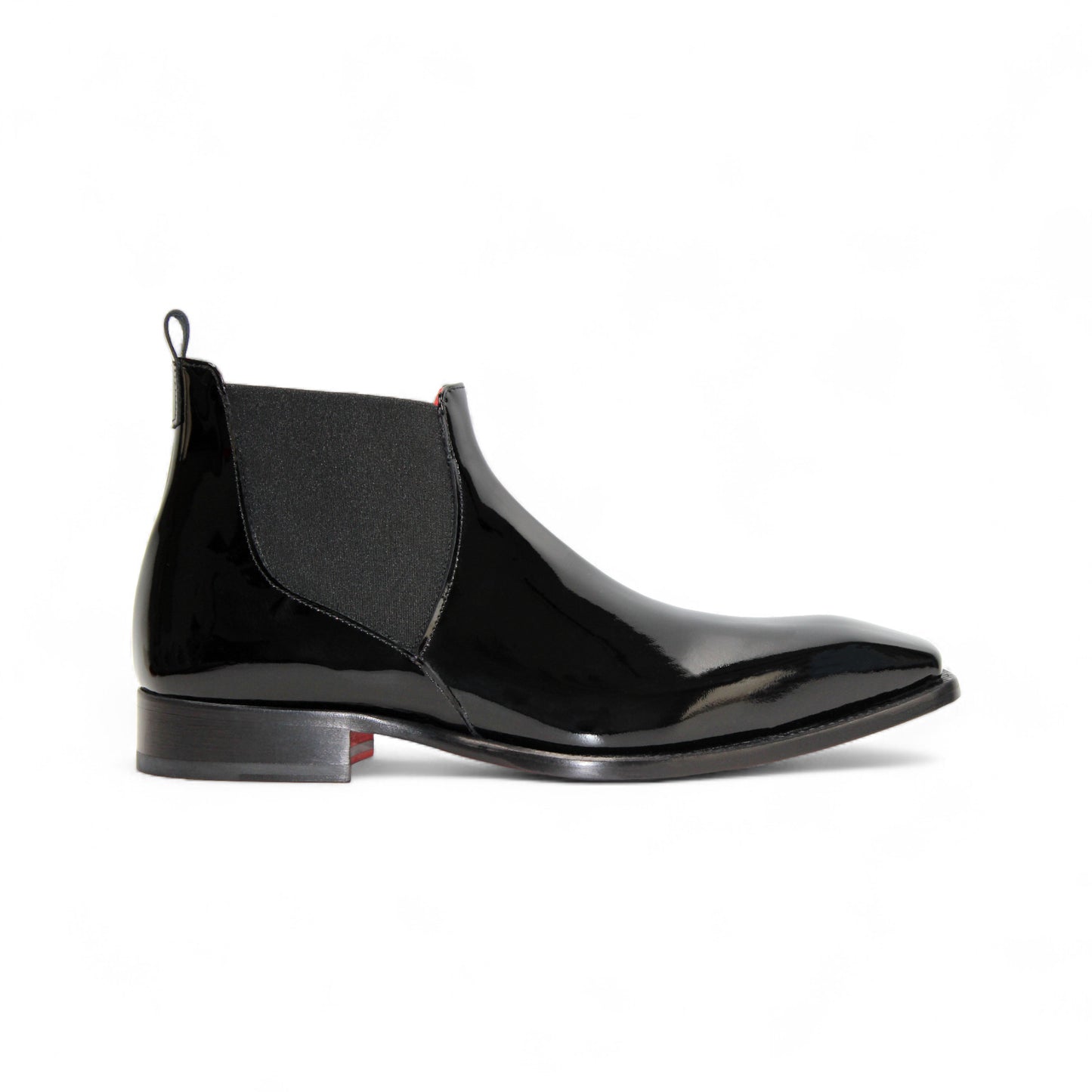 The Emilio Franco Leonardo Black is a polished Italian patent leather Chelsea boot with an elastic side panel and low heel, shown in profile against a white background—classic elegance from Emilio Franco.