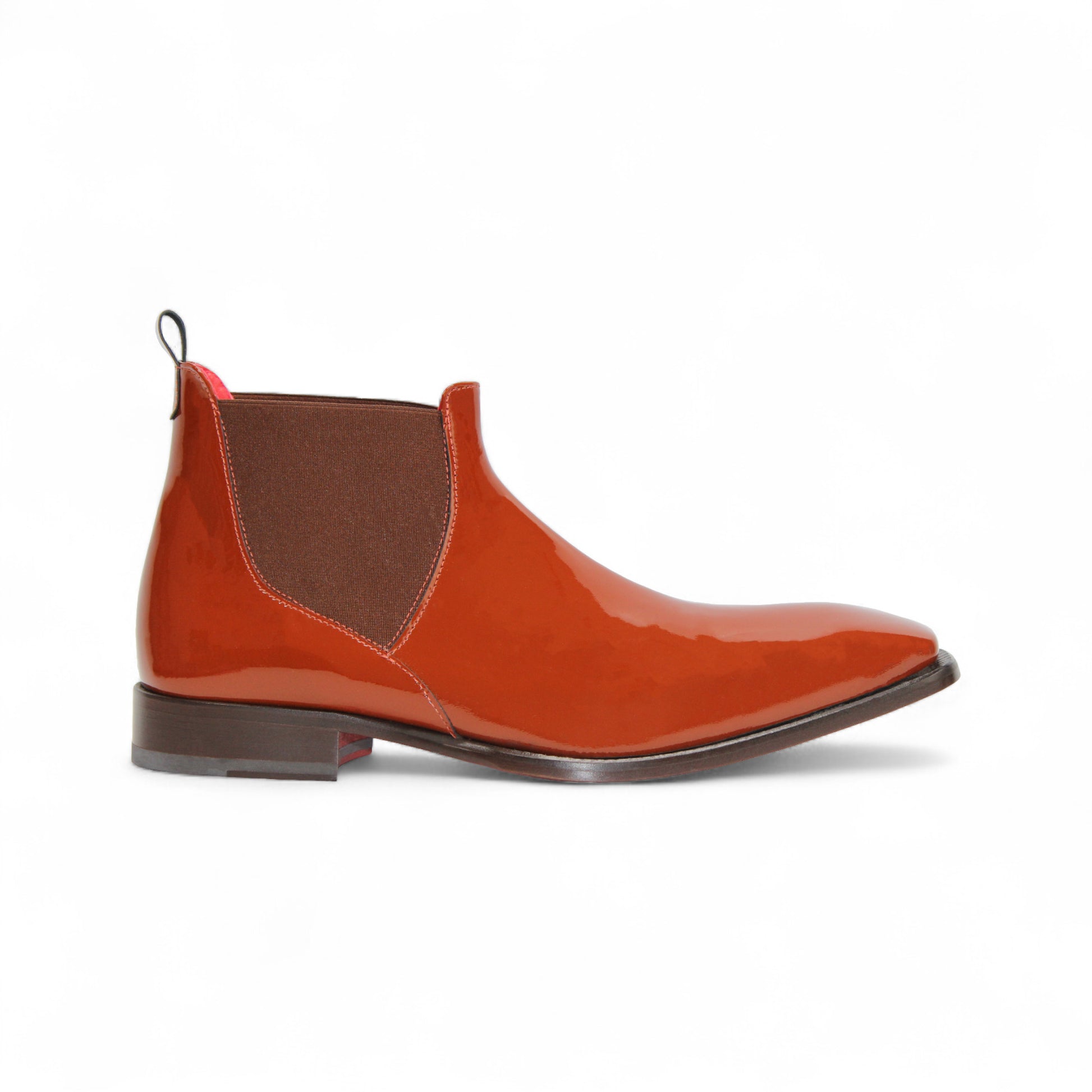 The Emilio Franco Leonardo Brandy is a shiny brown leather Chelsea boot with an elastic side panel, pull tab, and low heel by Emilio Franco, displayed on a white background.