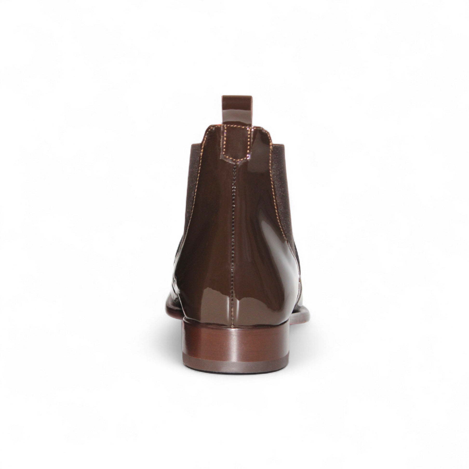 The Emilio Franco Leonardo Chocolate, a brown glossy Chelsea boot by Emilio Franco, showcases Italian craftsmanship with elastic side panels, a heel pull tab, and a low wooden heel, presented in side profile on a white background.