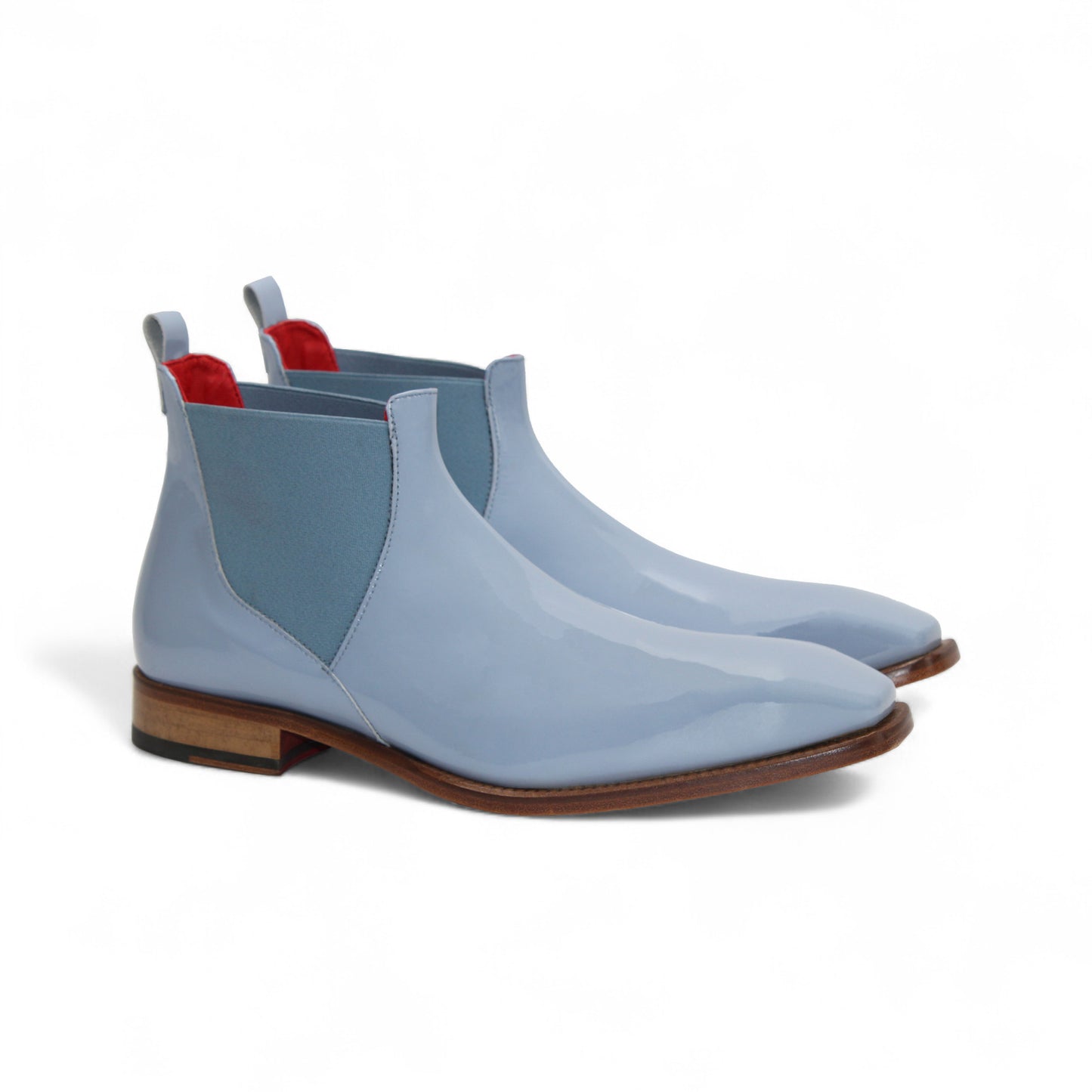 The Emilio Franco Leonardo Light Blue is a men's Italian patent leather Chelsea boot with elastic side panels, a leather sole, and pull tab, shown in profile on a white background—a stylish dress shoe by Emilio Franco.