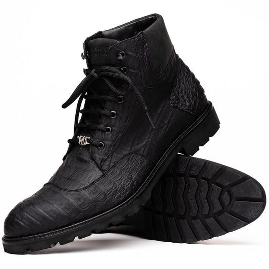 The Leoni Oil Black boots by Marco Di Milano feature genuine caiman leather in a crocodile texture, black laces, and rugged rubber soles—luxurious footwear with striking details.