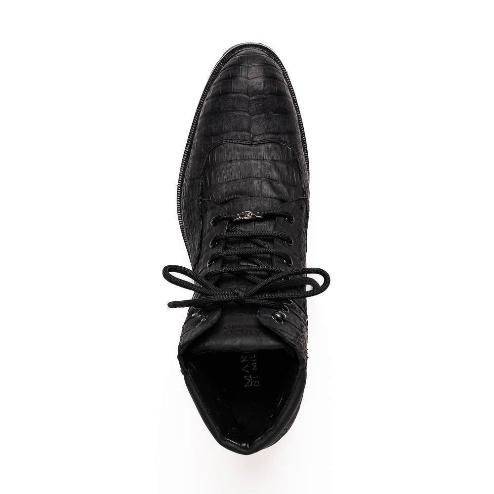 The Leoni Oil Black boots by Marco Di Milano feature genuine caiman leather in a crocodile texture, black laces, and rugged rubber soles—luxurious footwear with striking details.
