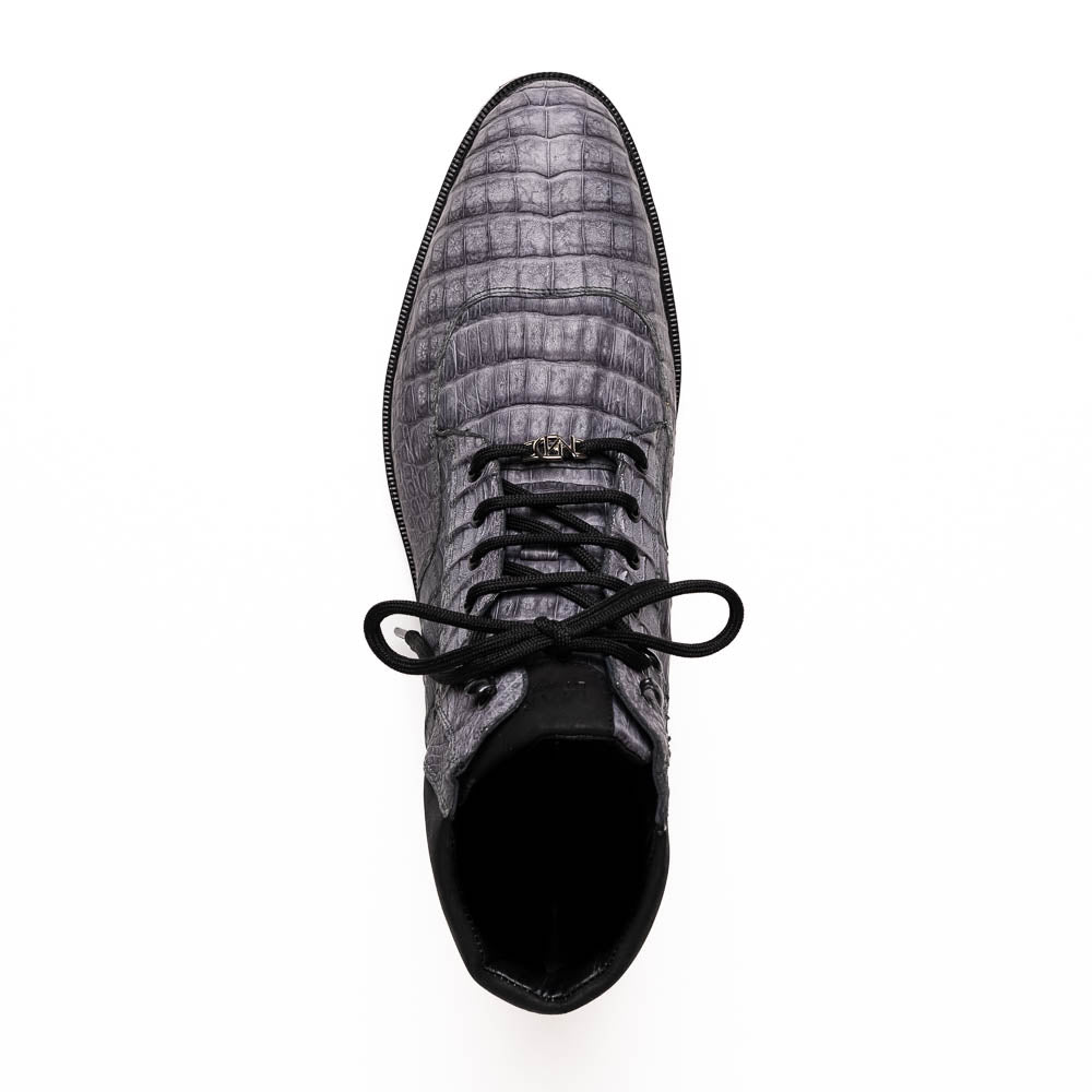The Leoni Oil Gray boot by Marco Di Milano features a gray, crocodile-patterned design in genuine caiman leather with black laces, a thick rugged sole, and hand-painted finishes—all showcased on a white background.