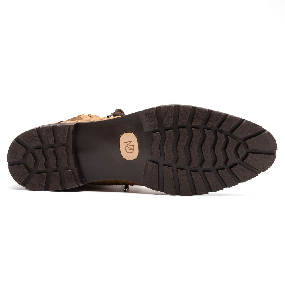 The Leoni Oil Orix by Marco Di Milano features tan crocodile-patterned leather lace-up boots with brown rubber soles, showcased upright and sideways to highlight the tread—a refined choice in luxury men's footwear.