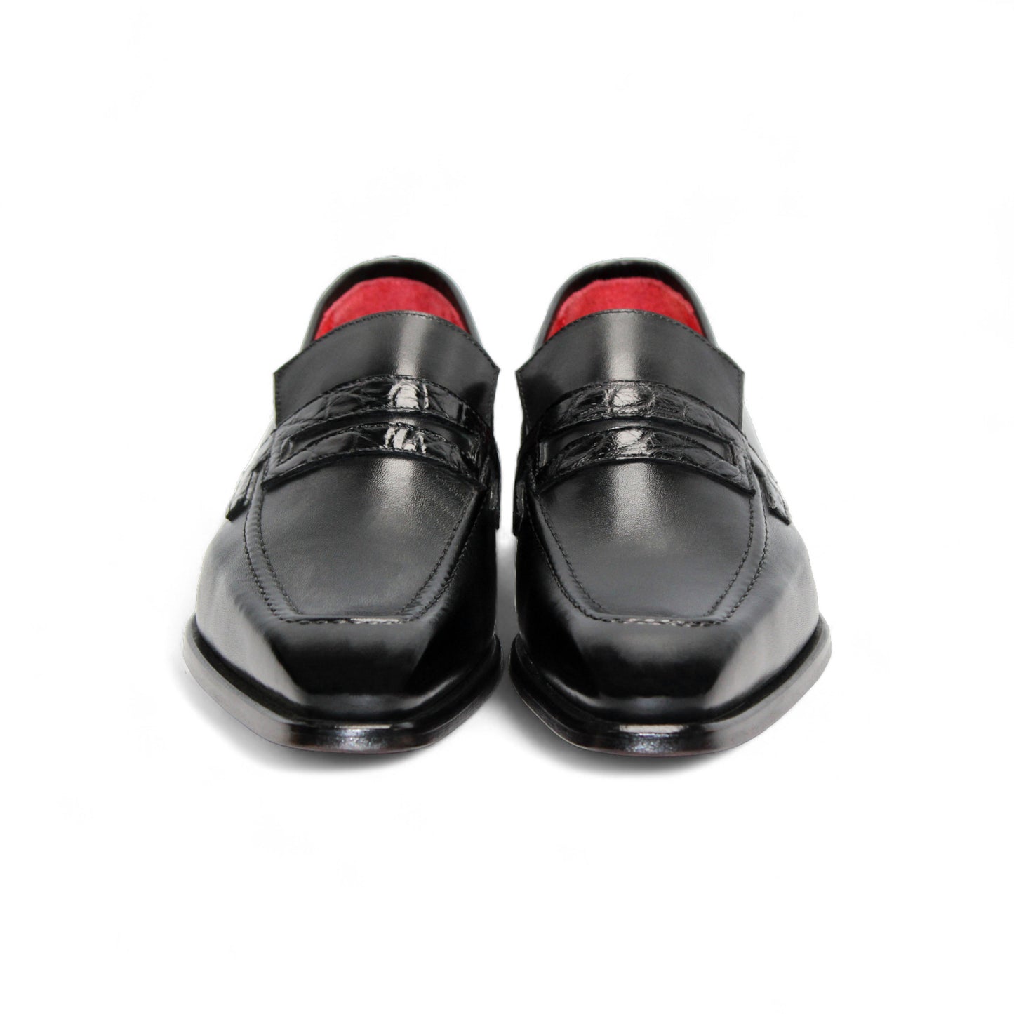 The Fennix Liam Black by Fennix of Italy is a black leather loafer with a low heel and red interior lining, showcasing Italian craftsmanship, displayed in side profile on a white background.