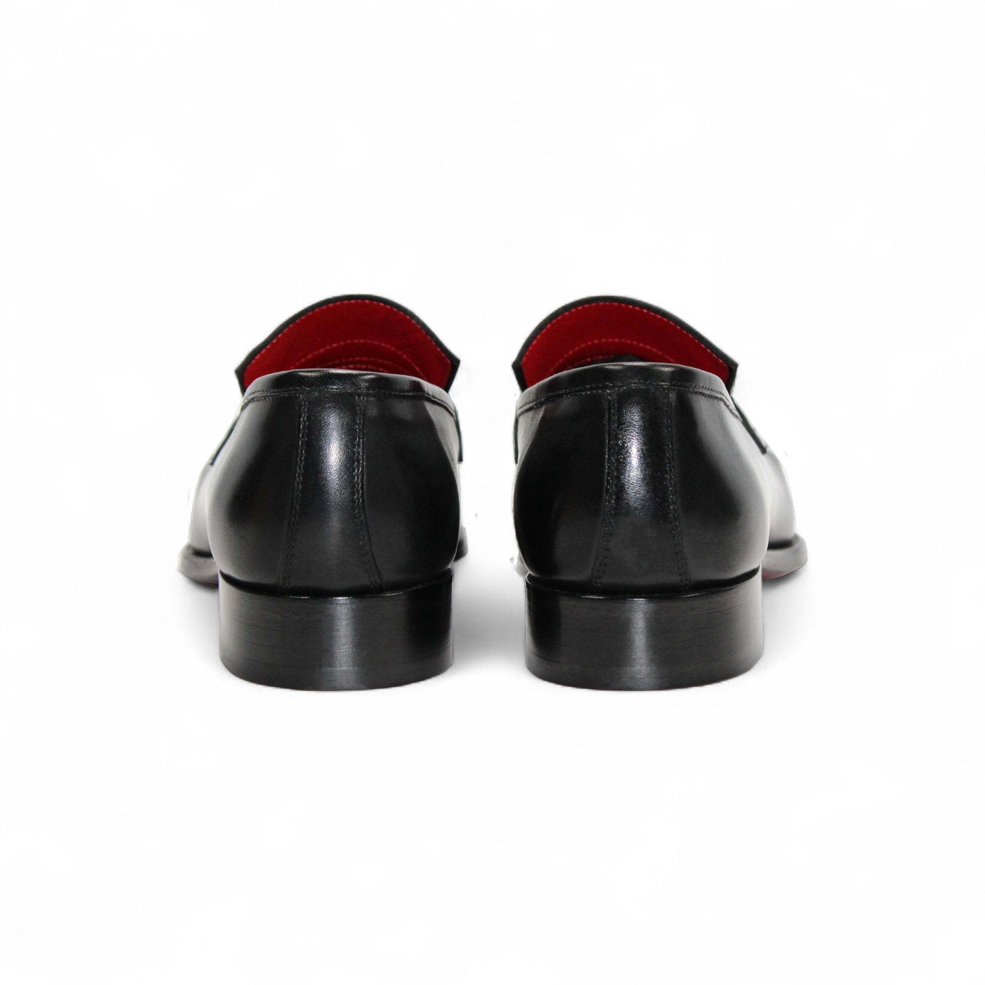 The Fennix Liam Black by Fennix of Italy is a black leather loafer with a low heel and red interior lining, showcasing Italian craftsmanship, displayed in side profile on a white background.