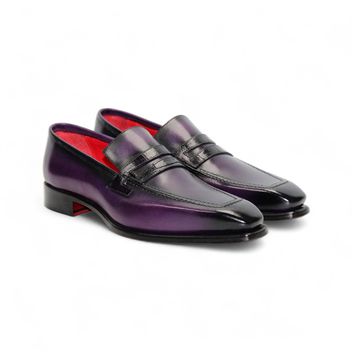 The Fennix of Italy Fennix Liam Purple is a purple leather loafer with a low heel, penny strap, and leather sole crafted in Italy, displayed in profile on a white background.