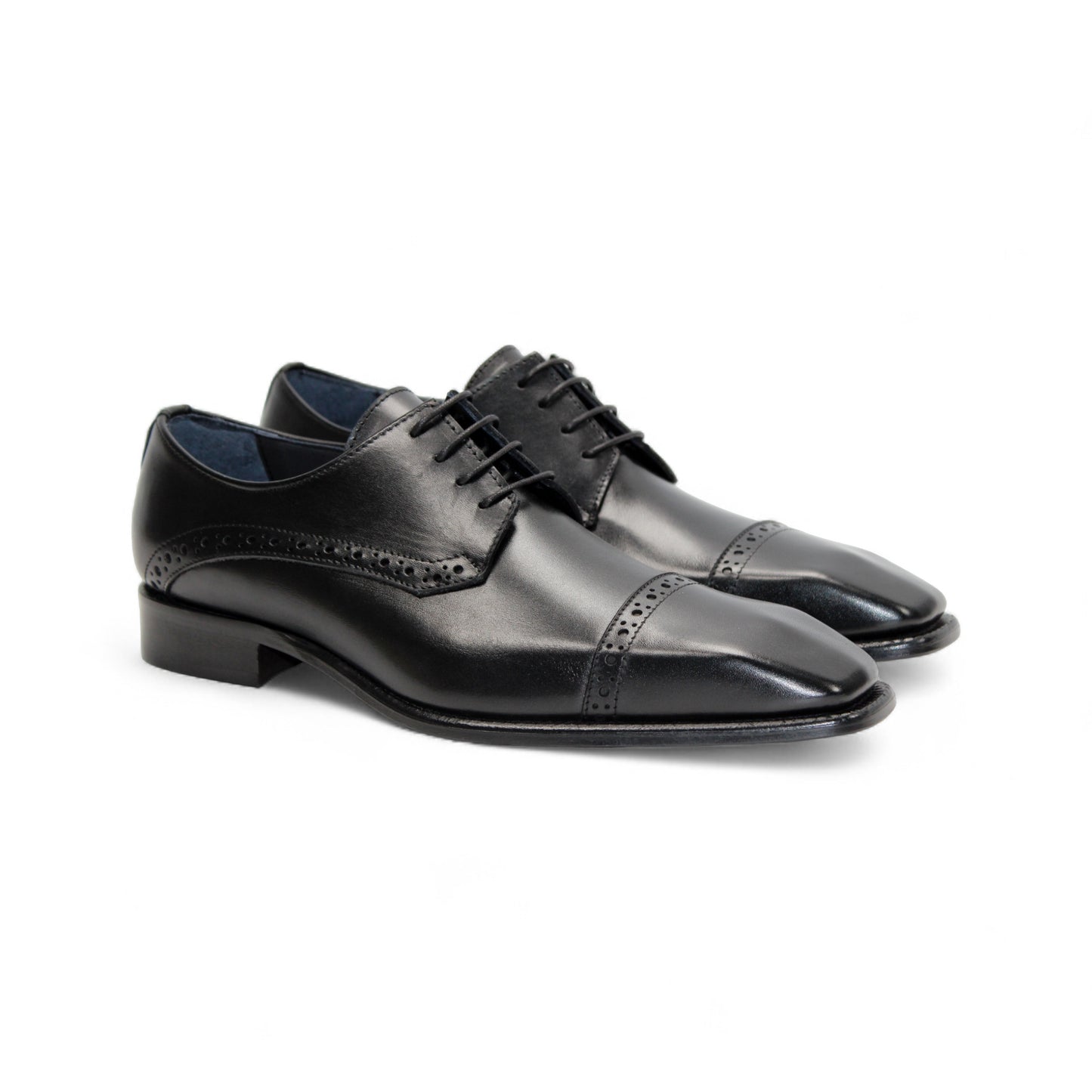 The Duca Di Matiste Duca Lombardi Black is an Italian-made leather dress shoe with brogue details, cap toe, closed lacing, low heel, and leather sole. Shown in profile on a white background.