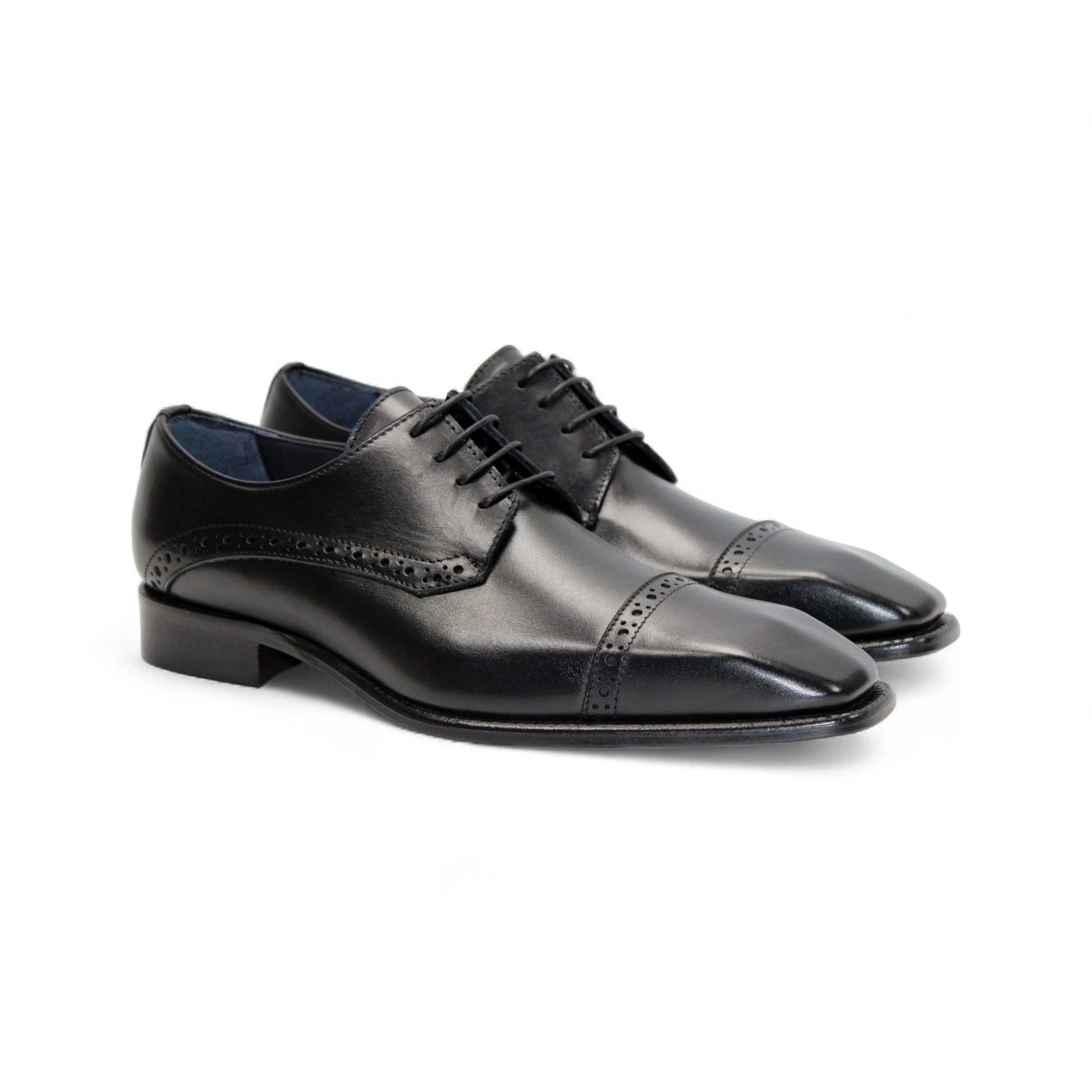 The Duca Di Matiste Duca Lombardi Black is an Italian-made leather dress shoe with brogue details, cap toe, closed lacing, low heel, and leather sole. Shown in profile on a white background.