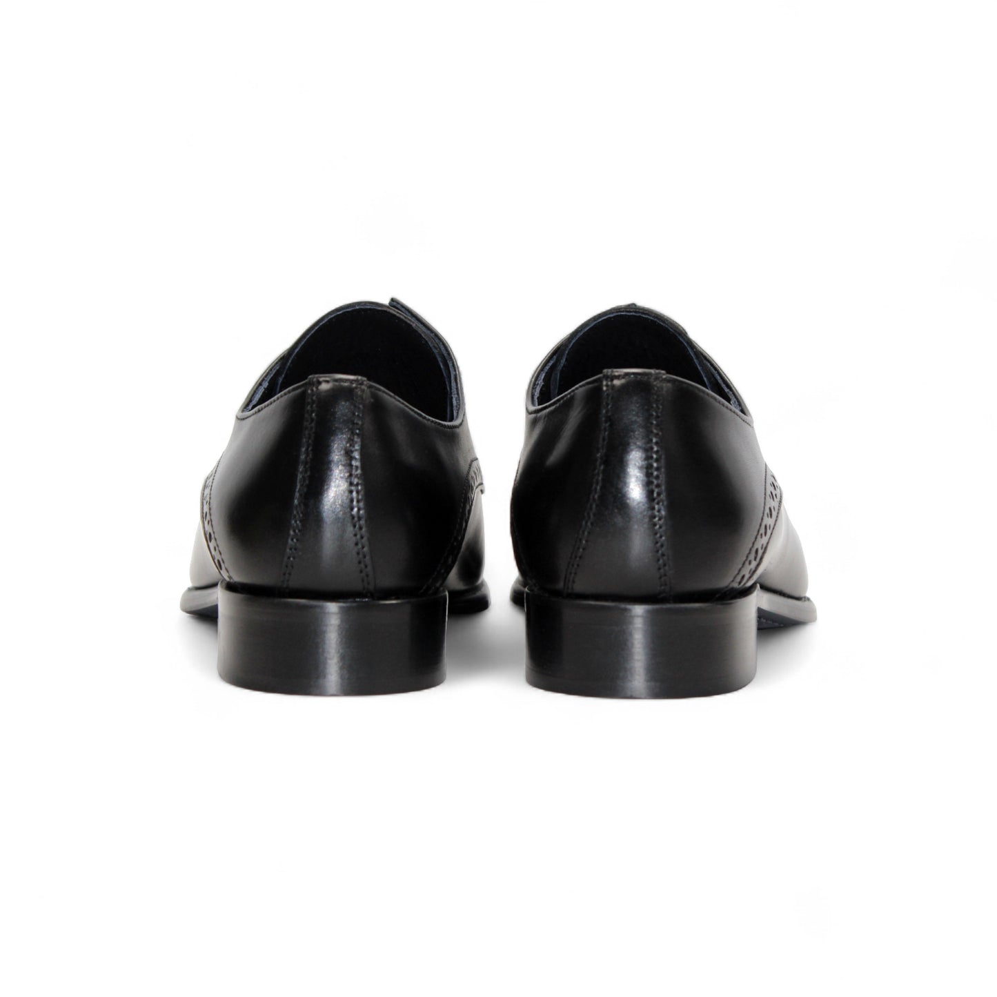 The Duca Di Matiste Duca Lombardi Black is an Italian-made leather dress shoe with brogue details, cap toe, closed lacing, low heel, and leather sole. Shown in profile on a white background.