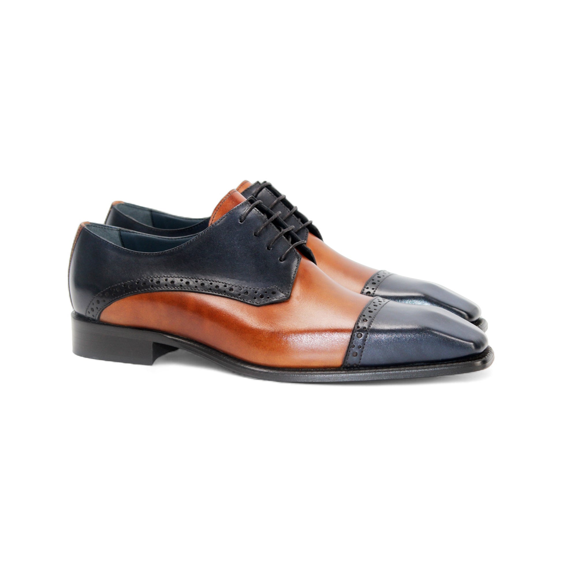 The Duca Di Matiste Duca Lombardi Blue/Cognac features genuine leather in blue and cognac panels, decorative perforations, a low heel, and a leather sole, captured on a white background.