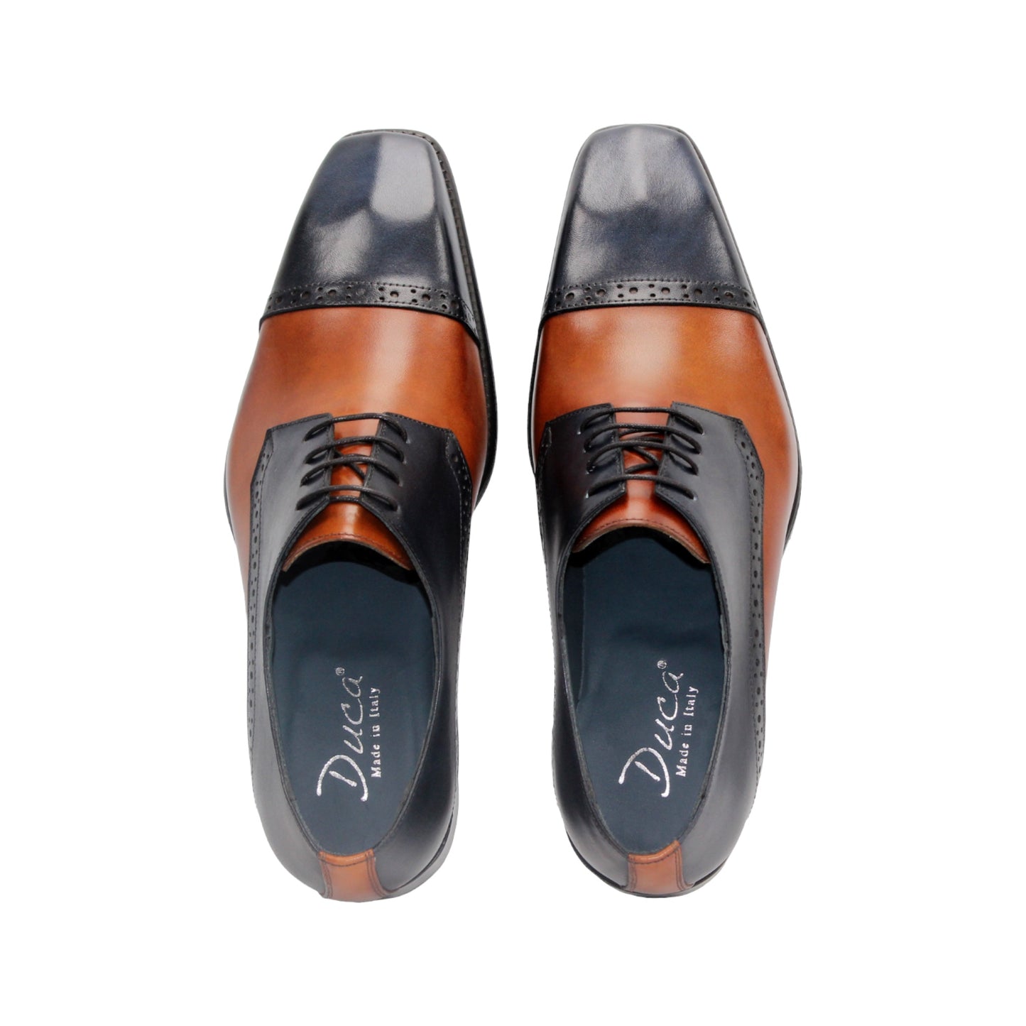 The Duca Di Matiste Duca Lombardi Blue/Cognac features genuine leather in blue and cognac panels, decorative perforations, a low heel, and a leather sole, captured on a white background.