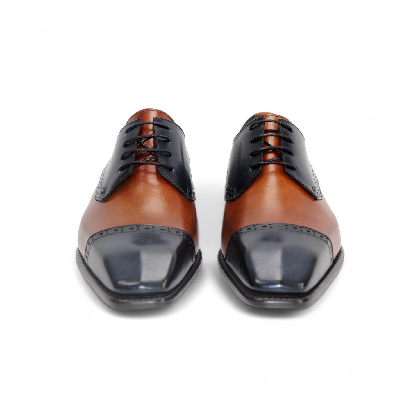 The Duca Di Matiste Duca Lombardi Blue/Cognac features genuine leather in blue and cognac panels, decorative perforations, a low heel, and a leather sole, captured on a white background.