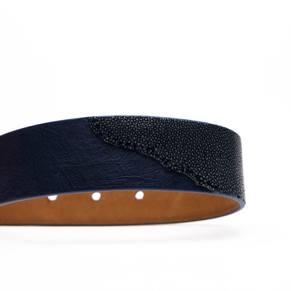 The Lucca Belt Navy / Navy by Marco Di Milano is a dark blue leather belt with a silver engraved buckle, coiled on a white background—ideal for pairing with luxury footwear or matching ostrich-stingray styles.