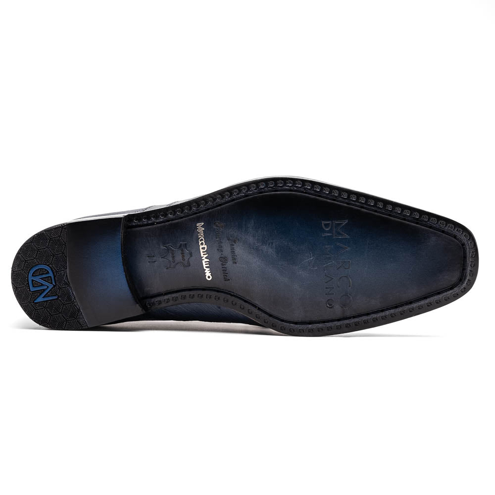 The Lucca Navy by Marco Di Milano: dark blue ostrich dress derby shoes with black soles, lace-up closures, and a textured finish. One shoe stands upright while the other lays on its side, highlighting hand-painted details.