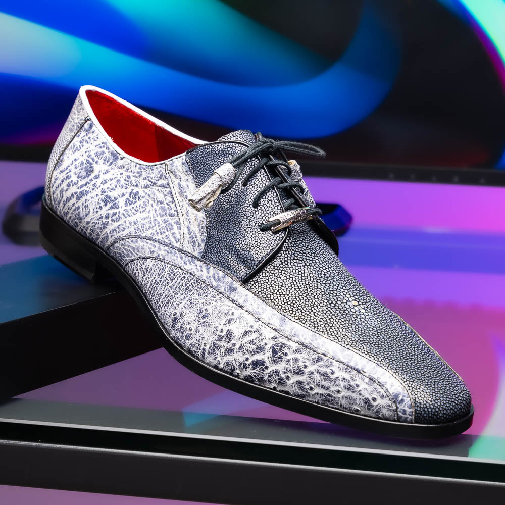 The Lucca Newspaper by Marco Di Milano are luxury men's dress shoes crafted from genuine stingray, featuring a textured gray and black upper, black laces, red inner lining, and brown leather soles with branded detail.