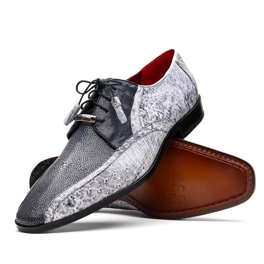 The Lucca Newspaper by Marco Di Milano are luxury men's dress shoes crafted from genuine stingray, featuring a textured gray and black upper, black laces, red inner lining, and brown leather soles with branded detail.