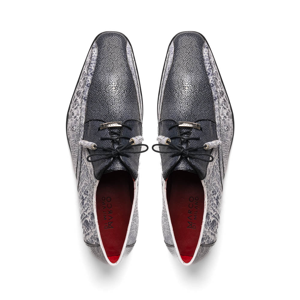 The Lucca Newspaper by Marco Di Milano are luxury men's dress shoes crafted from genuine stingray, featuring a textured gray and black upper, black laces, red inner lining, and brown leather soles with branded detail.