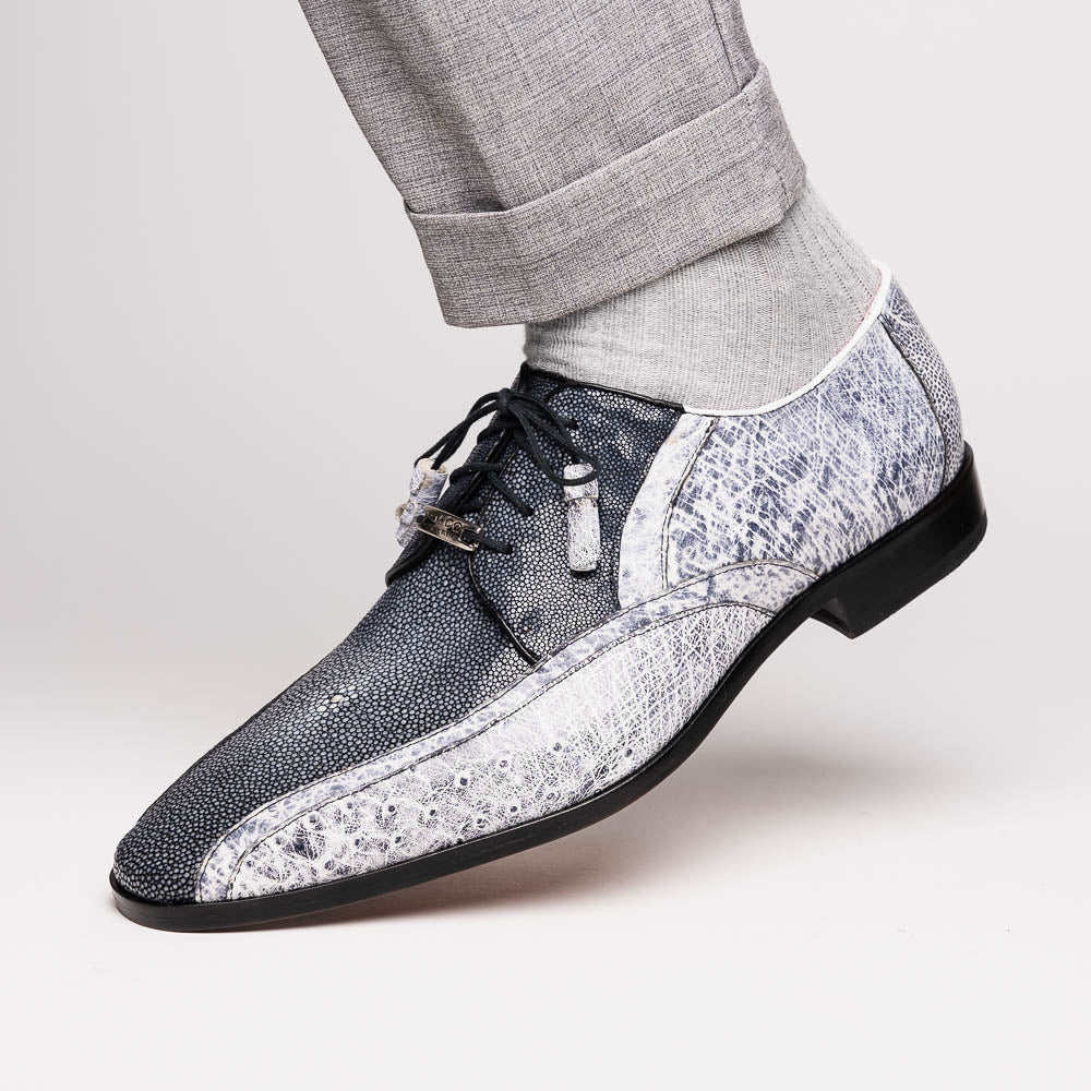 The Lucca Newspaper by Marco Di Milano are luxury men's dress shoes crafted from genuine stingray, featuring a textured gray and black upper, black laces, red inner lining, and brown leather soles with branded detail.