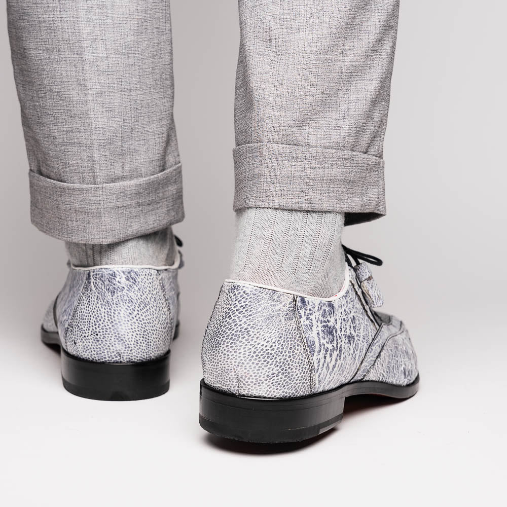 The Lucca Newspaper by Marco Di Milano are luxury men's dress shoes crafted from genuine stingray, featuring a textured gray and black upper, black laces, red inner lining, and brown leather soles with branded detail.