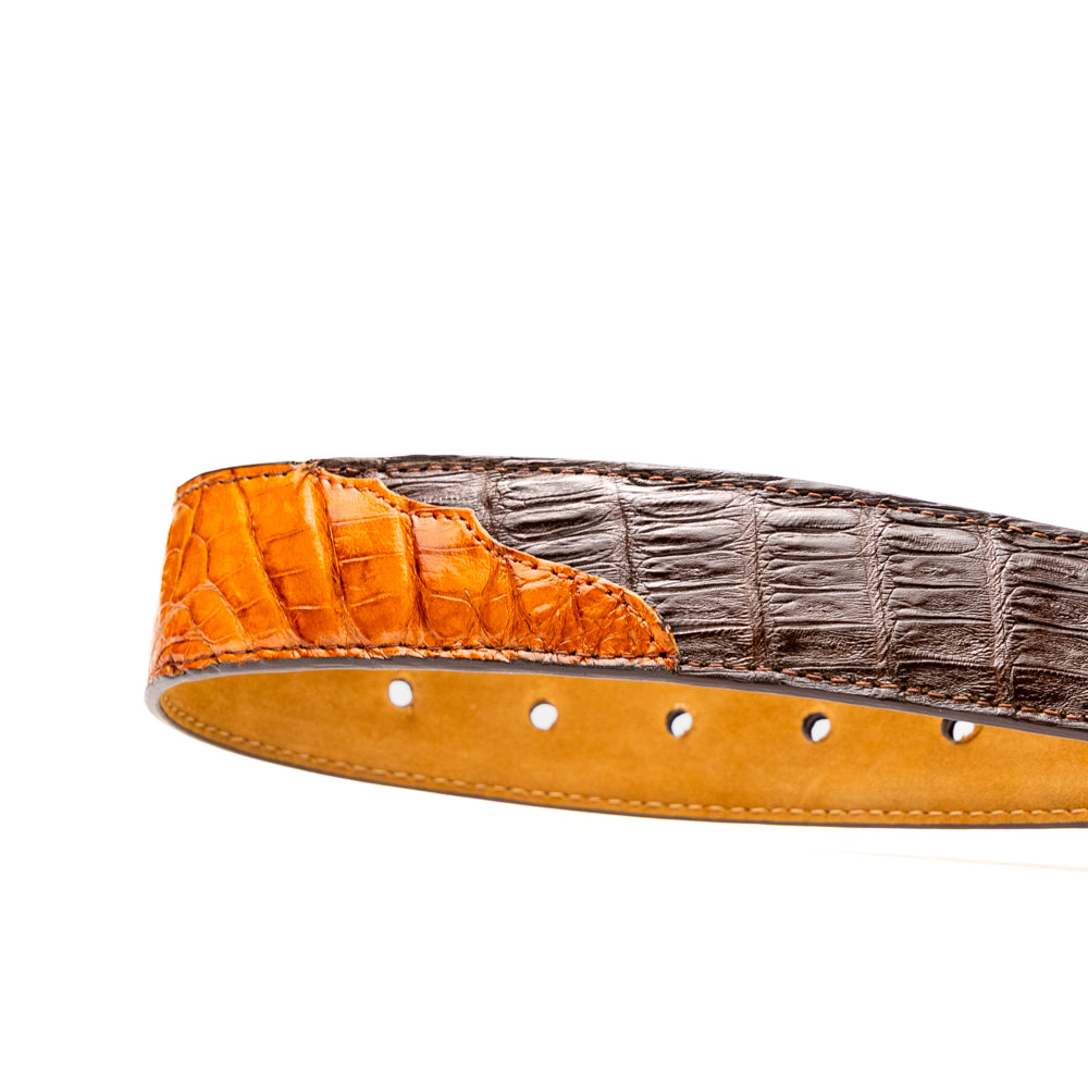 Two handcrafted men’s belts from Marco Di Milano—the Luciano Belt in Brown and Cognac—are coiled and stacked, each highlighted by a silver buckle. These premium accessories showcase the refined elegance and distinctive character of genuine caiman leather, perfect for those who value superior quality.
