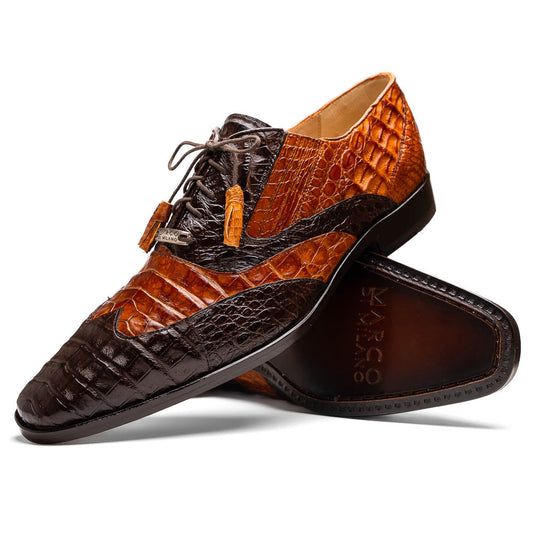 A pair of Marco Di Milano Luciano Brown / Cognac dress shoes with a pointed toe, lace-up closure, and embossed sole branding—ideal for elevating your luxury men's footwear collection.