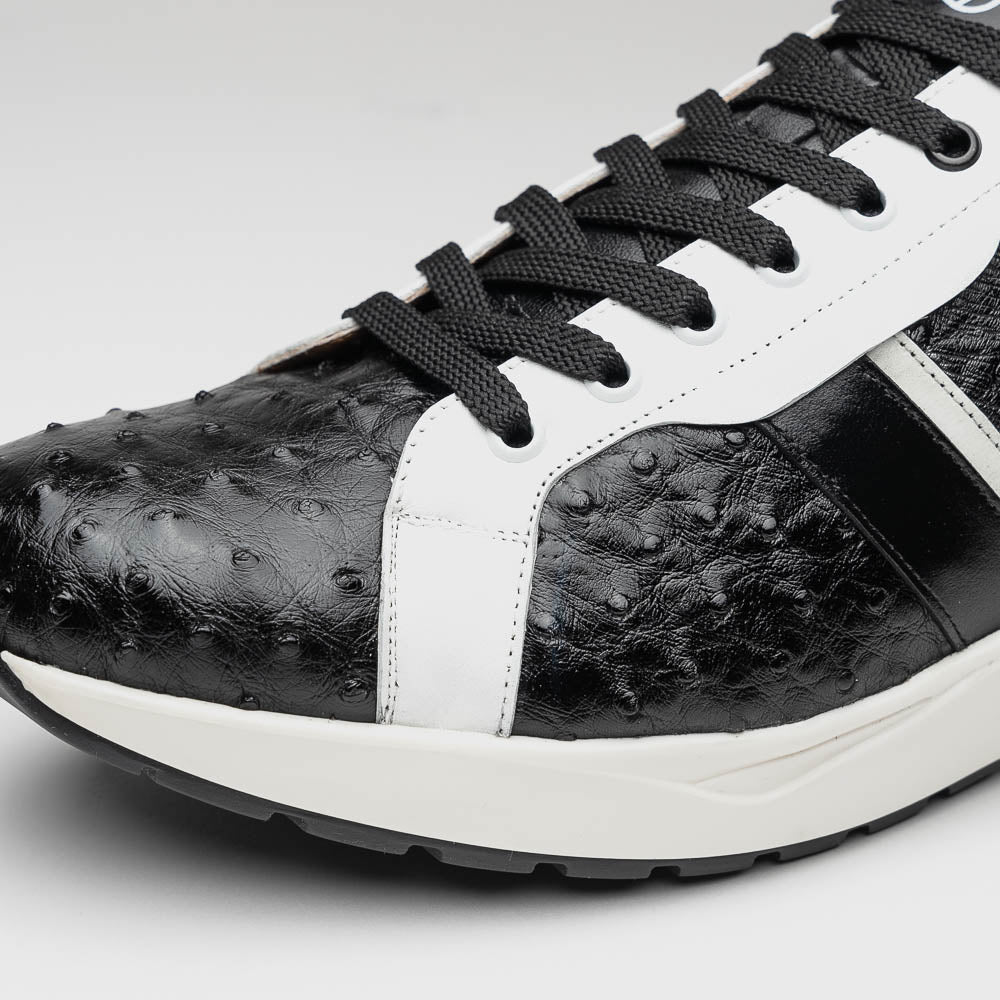 The Marco Di Milano Lyon II Black / White sneakers feature textured leather uppers, black laces, and rubber soles, displayed against a plain white background.