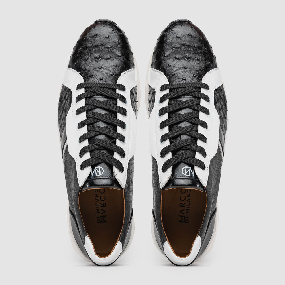 The Marco Di Milano Lyon II Black / White sneakers feature textured leather uppers, black laces, and rubber soles, displayed against a plain white background.