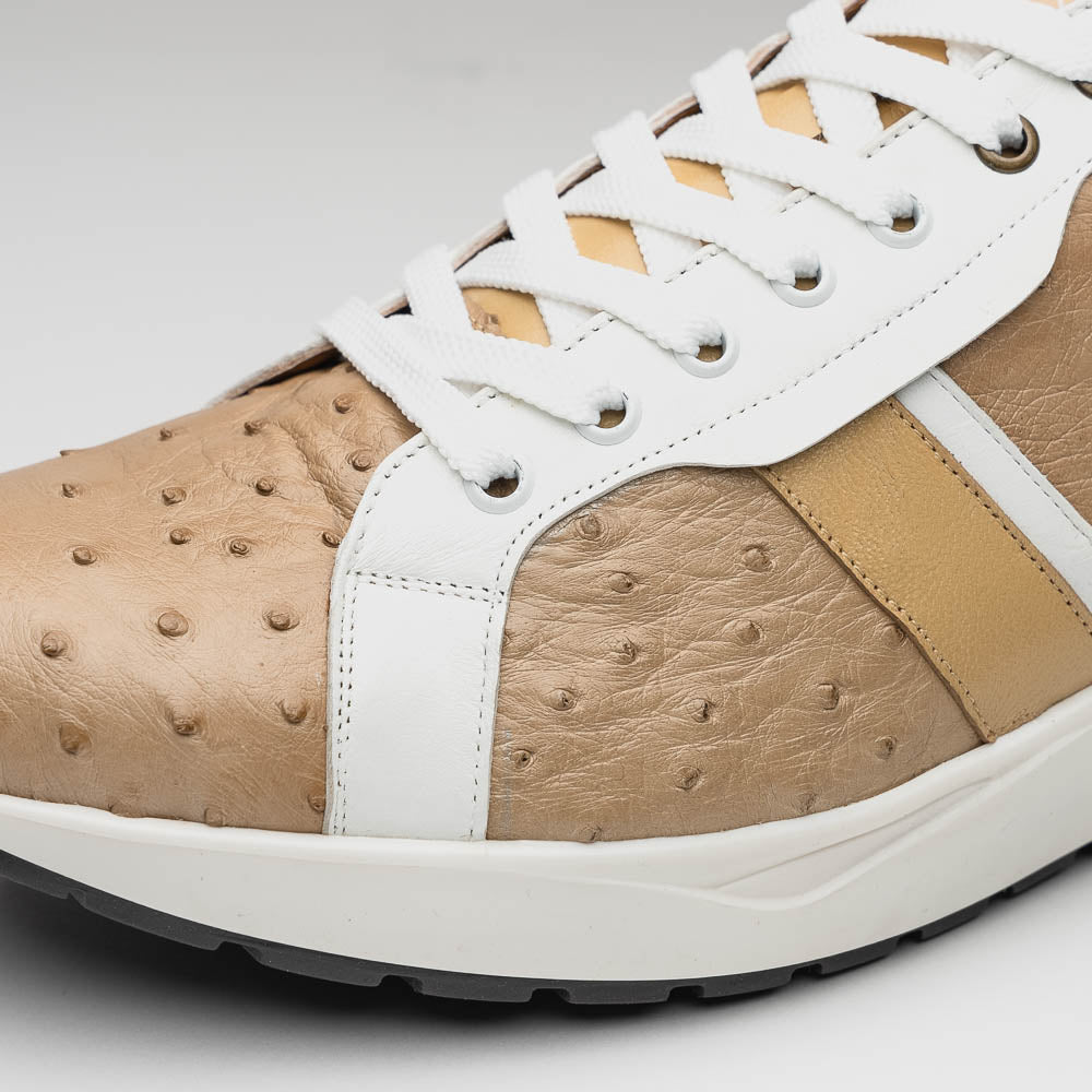 The Marco Di Milano Lyon II Orix / White sneakers feature beige and white ostrich quill-textured uppers and black rubber soles—an ideal choice for those seeking luxury footwear.