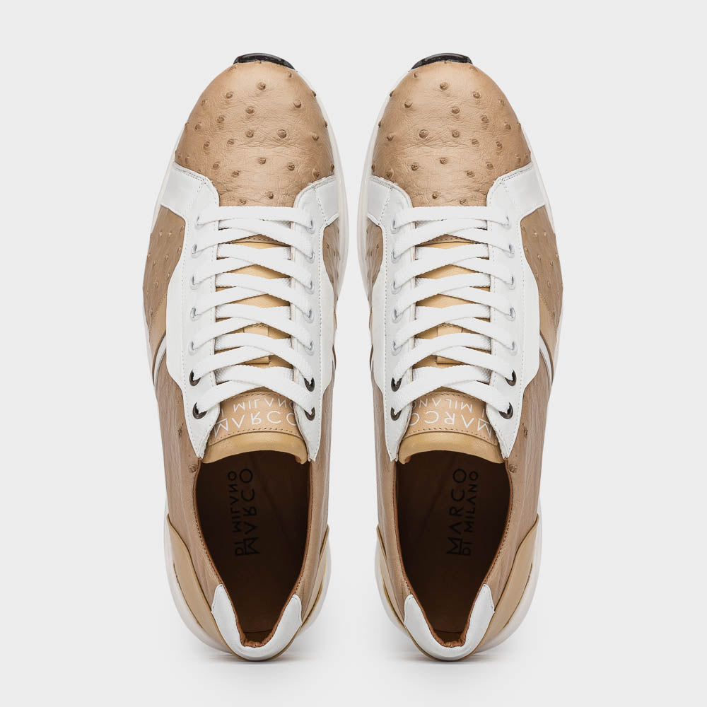 The Marco Di Milano Lyon II Orix / White sneakers feature beige and white ostrich quill-textured uppers and black rubber soles—an ideal choice for those seeking luxury footwear.