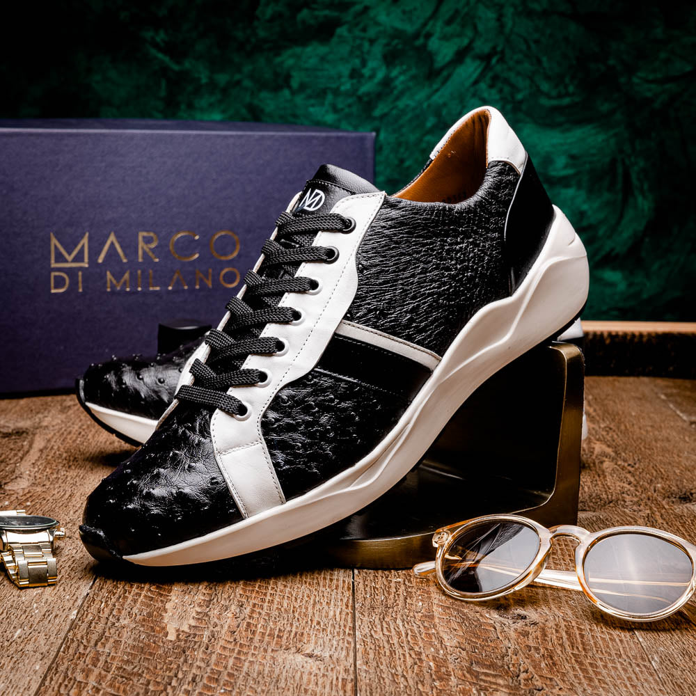 The Marco Di Milano Lyon II Black / White sneakers feature textured leather uppers, black laces, and rubber soles, displayed against a plain white background.