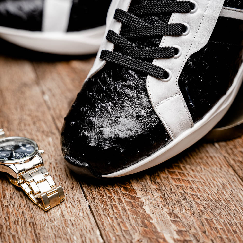 The Marco Di Milano Lyon II Black / White sneakers feature textured leather uppers, black laces, and rubber soles, displayed against a plain white background.