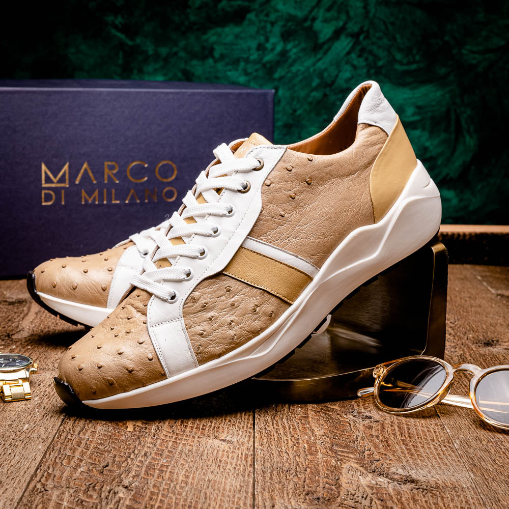 The Marco Di Milano Lyon II Orix / White sneakers feature beige and white ostrich quill-textured uppers and black rubber soles—an ideal choice for those seeking luxury footwear.