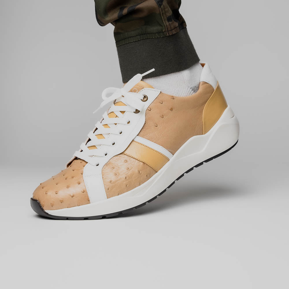 The Marco Di Milano Lyon II Orix / White sneakers feature beige and white ostrich quill-textured uppers and black rubber soles—an ideal choice for those seeking luxury footwear.
