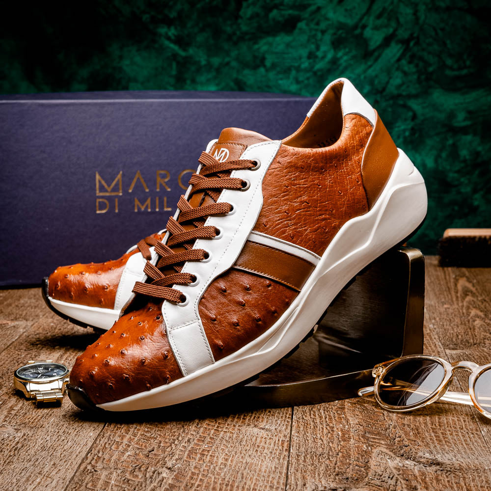 The Lyon II Brandy / White sneakers by Marco Di Milano feature a textured brown and white leather upper, white soles, and brown laces—a true statement in luxury footwear, shown against a plain white background.