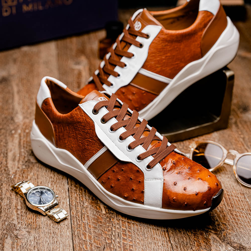 The Lyon II Brandy / White sneakers by Marco Di Milano feature a textured brown and white leather upper, white soles, and brown laces—a true statement in luxury footwear, shown against a plain white background.