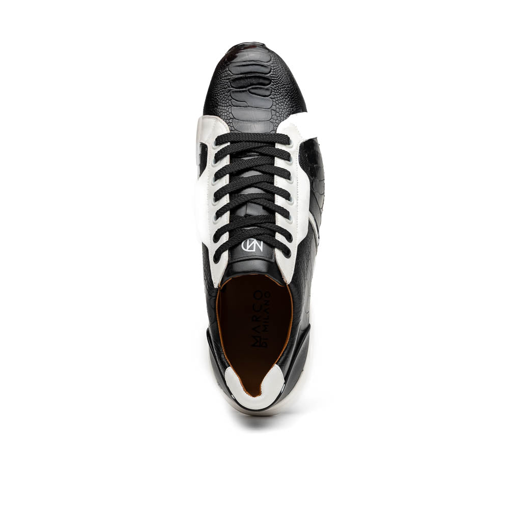 The Marco Di Milano Lyon Black / White sneakers feature a hand-painted, textured pattern, black laces, and rubber soles—one shoe shown upright, the other propped behind.