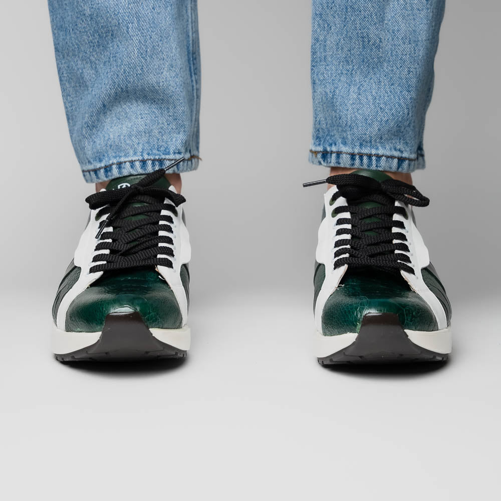 The Marco Di Milano Lyon Green / White sneakers feature green and white genuine ostrich leather with texture, black laces, and white rubber soles—one shoe stands upright while the other leans against it.